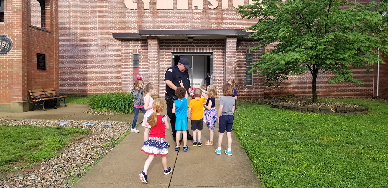 police officer with kids